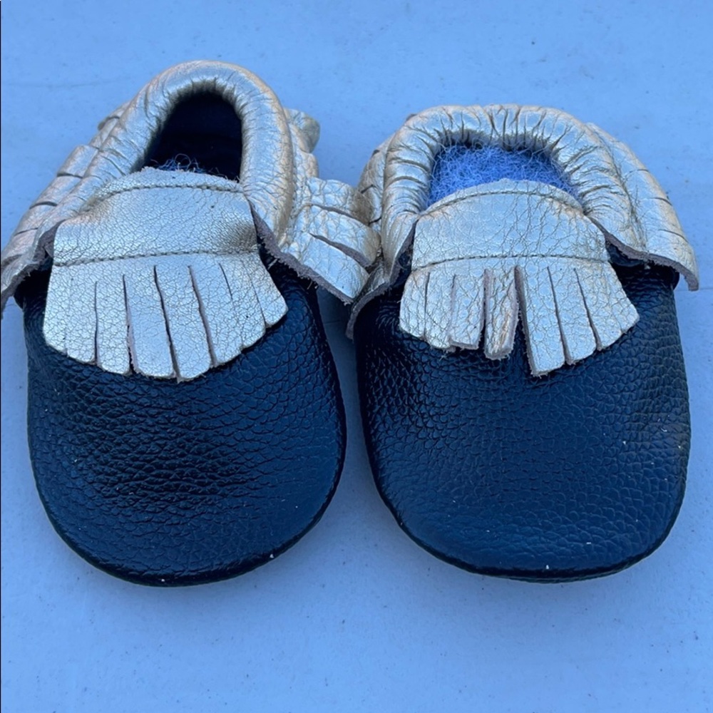 Black and gold moccasins